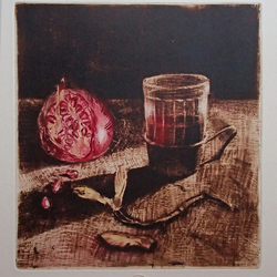 "A cup of tea and a pomegranate"