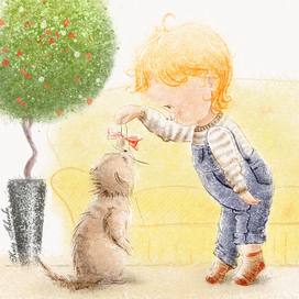 Мальчик играет с кошкой