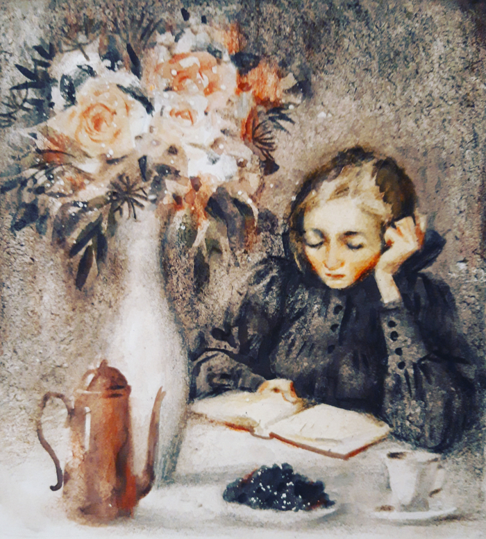 Девушка читает за столом