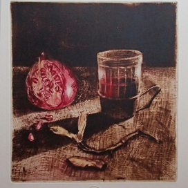 "A cup of tea and a pomegranate"