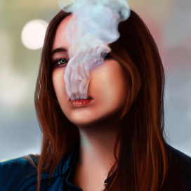 Девушка выдыхает дым