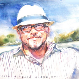 человек в белой шляпе