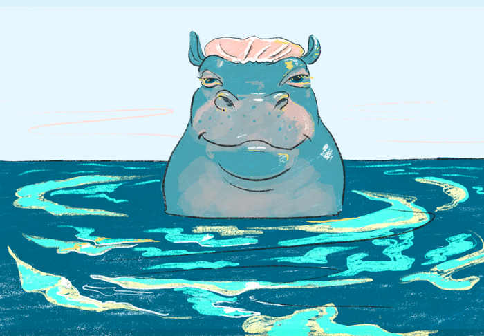Бегемот принимает ванну