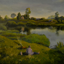 Рыбак на берегу реки