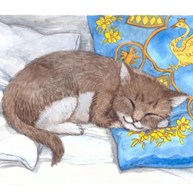 Котенок на подушке