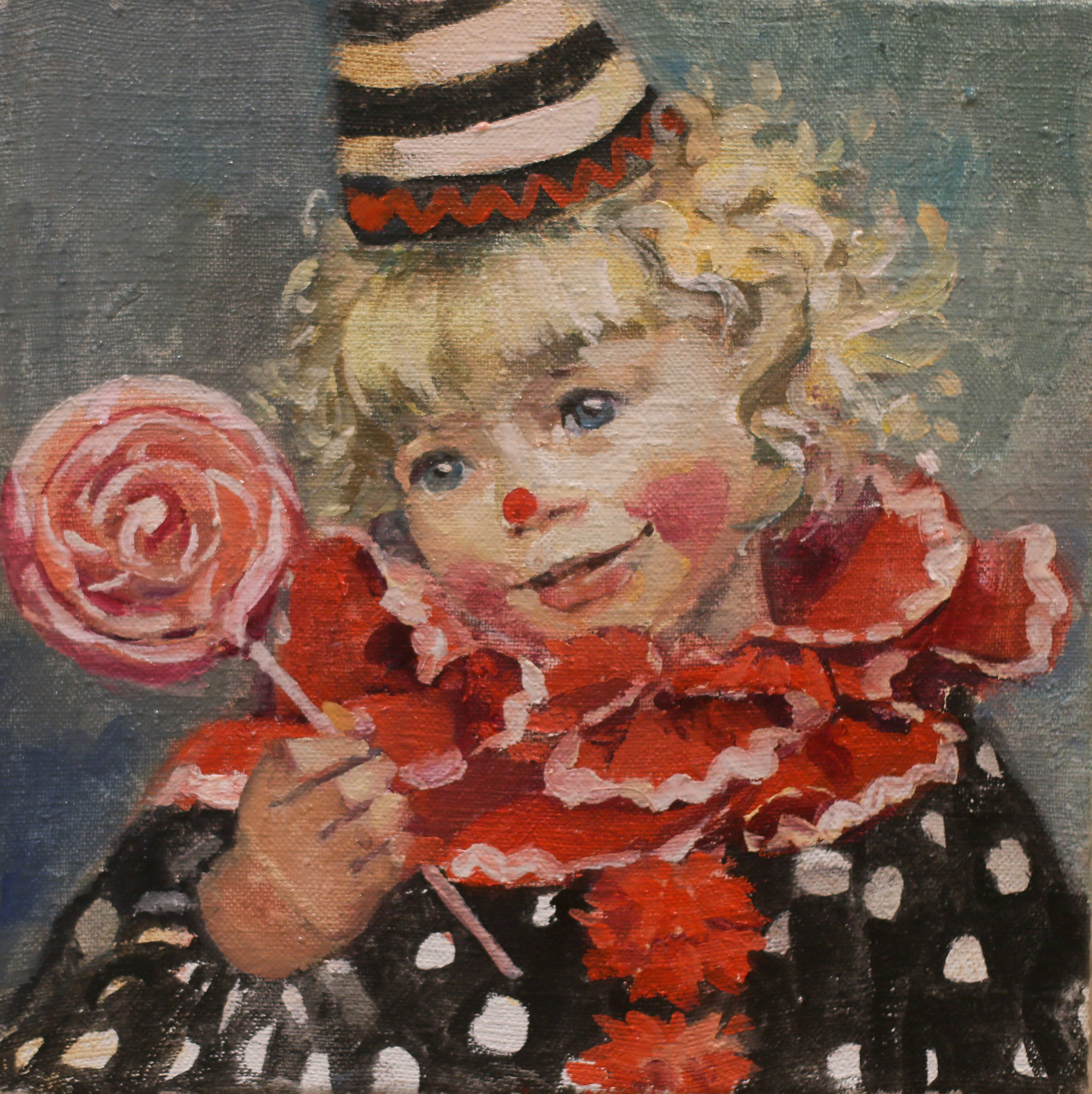 Маленький клоун с леденцом