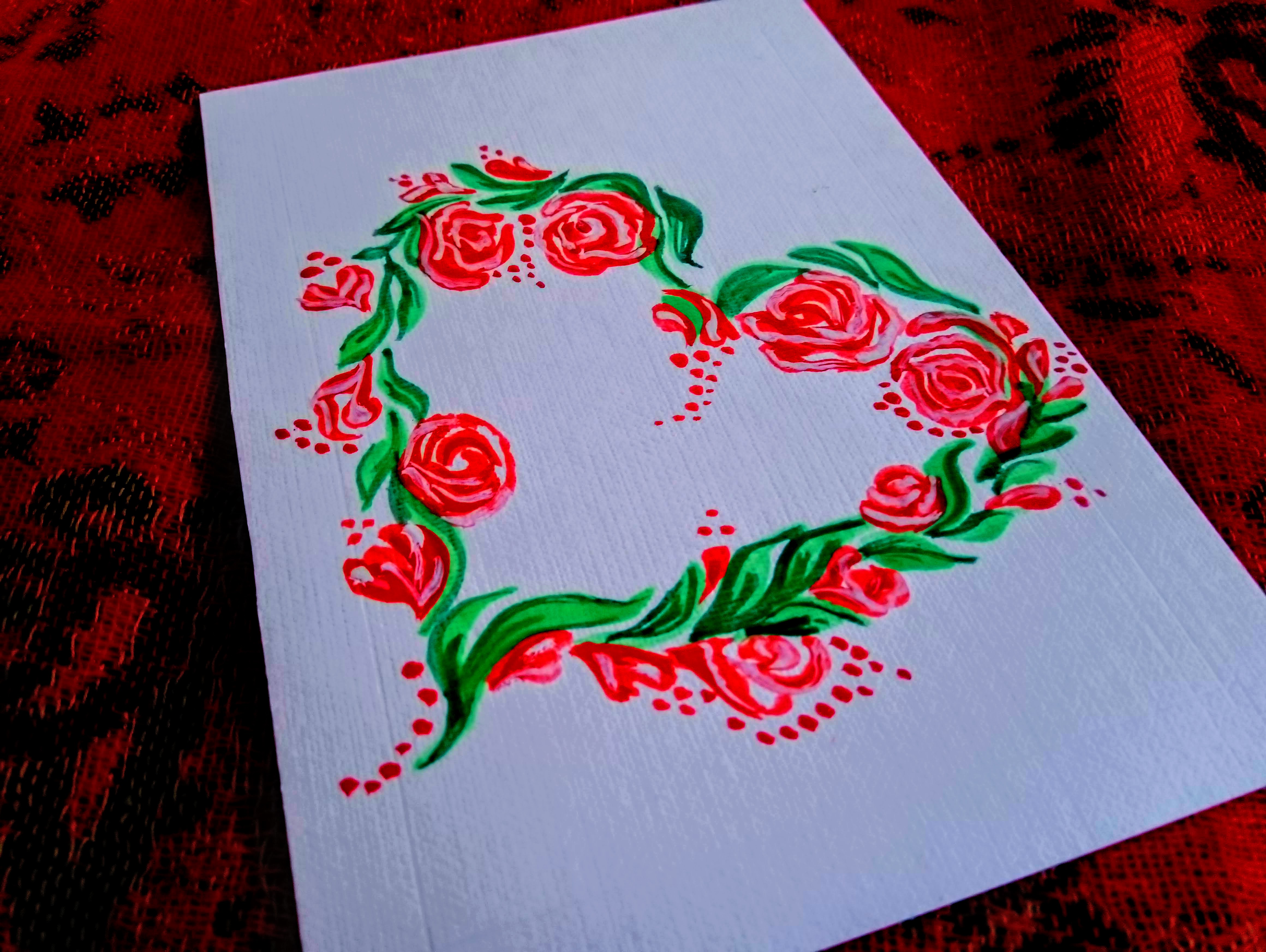 Открытка. Сердце из алых цветов