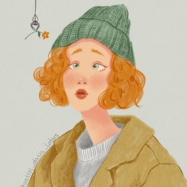 Рыжая девушка в зеленой шапке