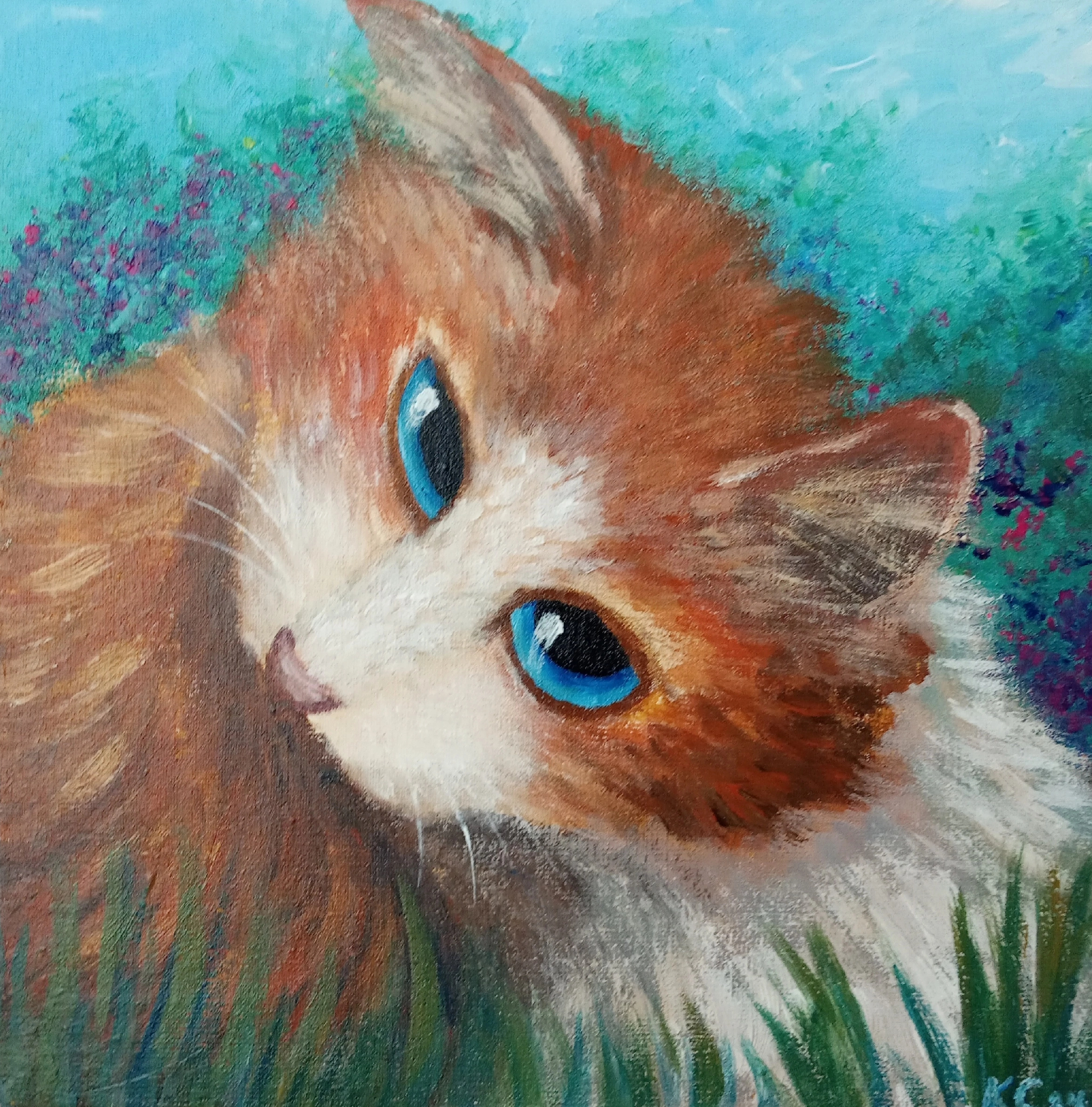 Рыжая кошка в траве