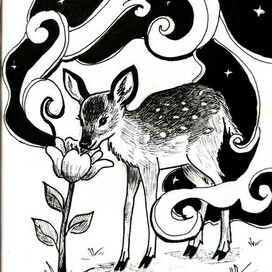 Олень нюхает цветок