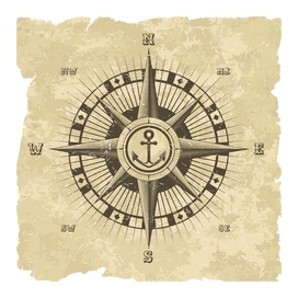 Vintage nautical wind rose. Hand drawn navigation symbol on the old paper sheet