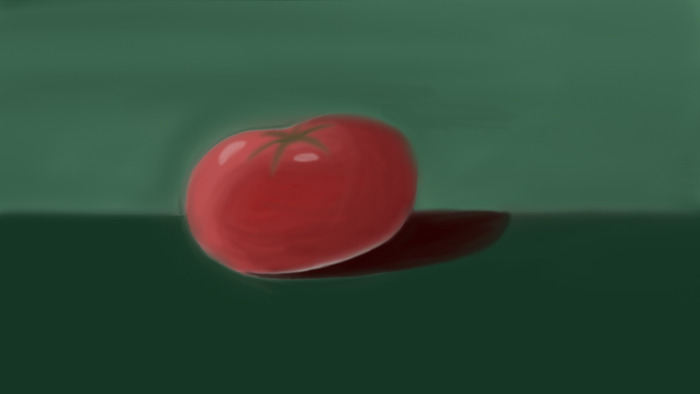 Tomato on a green background